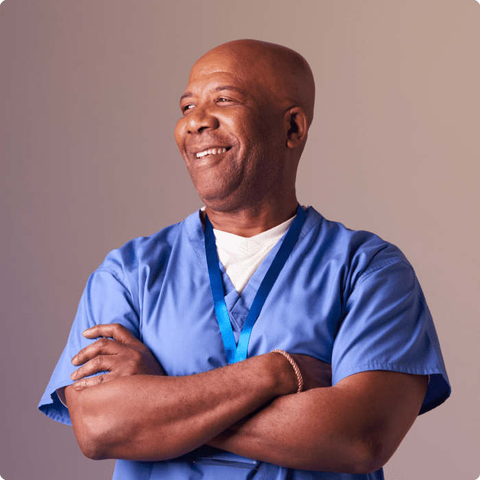 male doctor smiling away from camera