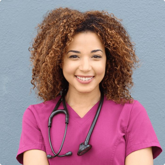 woman nurse in pink scrubs